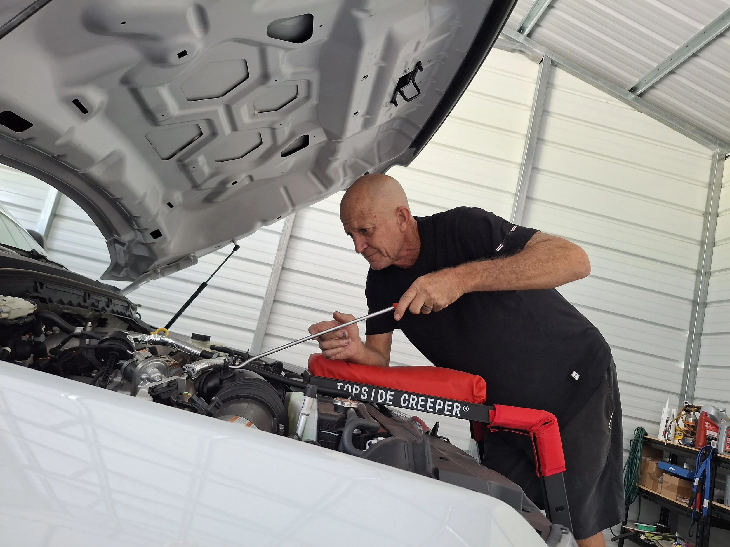 Dave working on a car Image