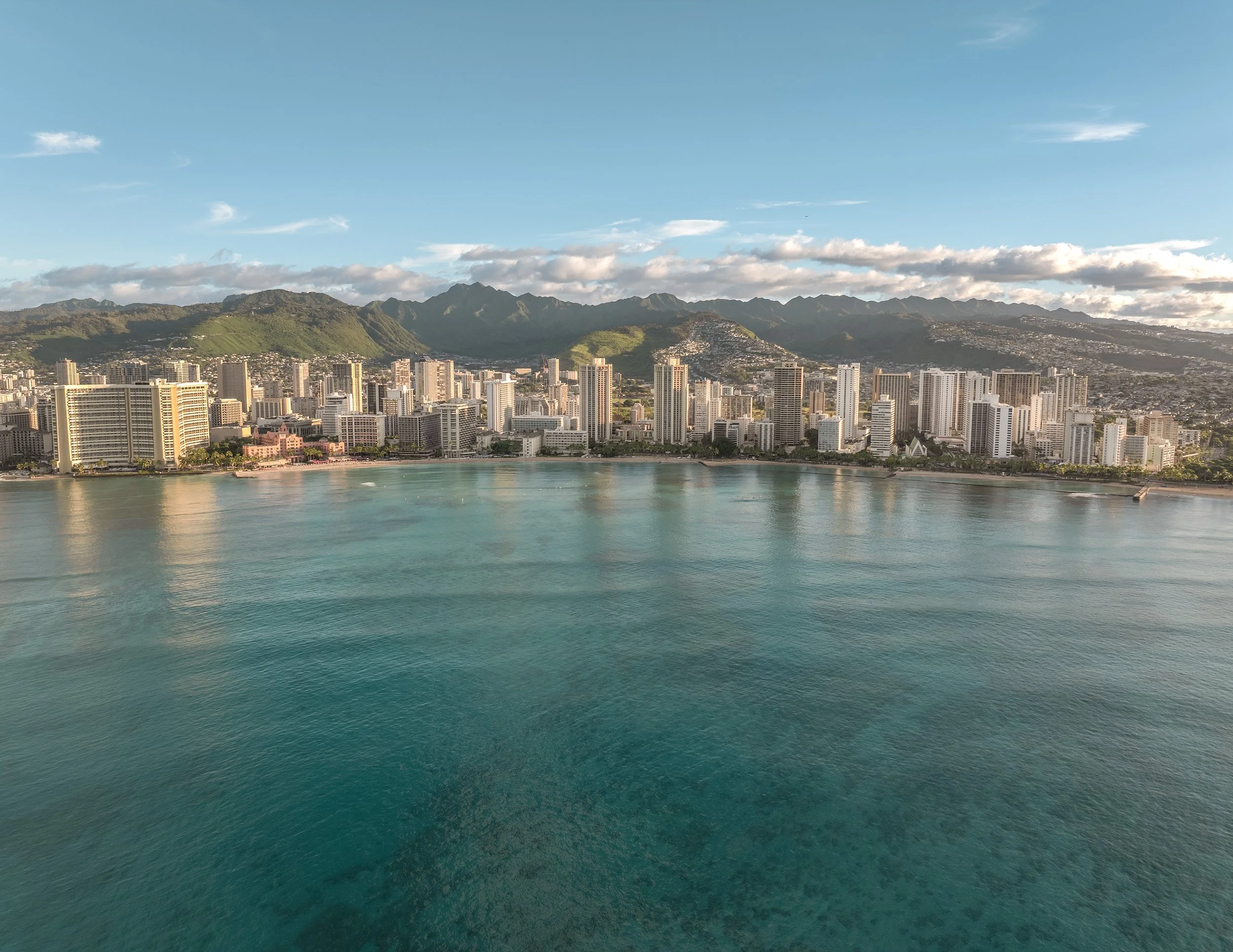 Drone image of Waikiki a spectacular aerial perspectives of Honolulu's iconic skyline shot at sunrise.