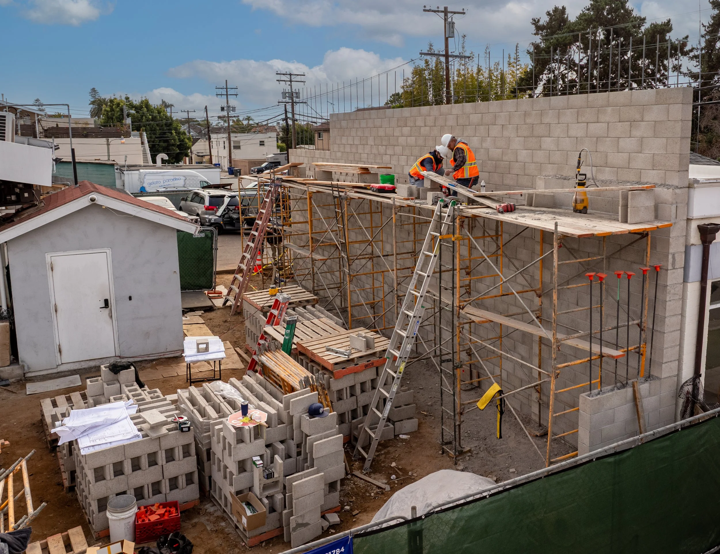 Drone Photography of a construction crew working on a tall retaining wall in Coronado , CA.