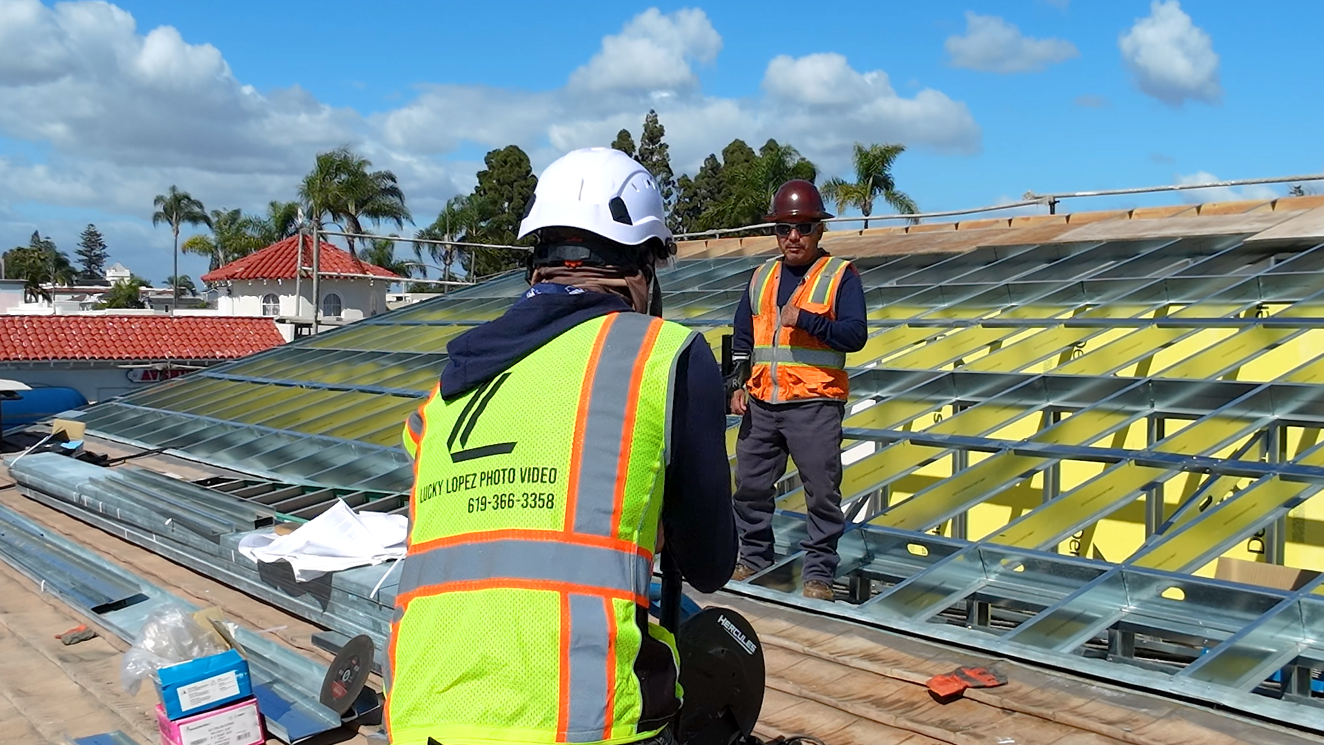 Lucky Lopez filming Jaime Mendez from Mendez Construction for a construction progress video.