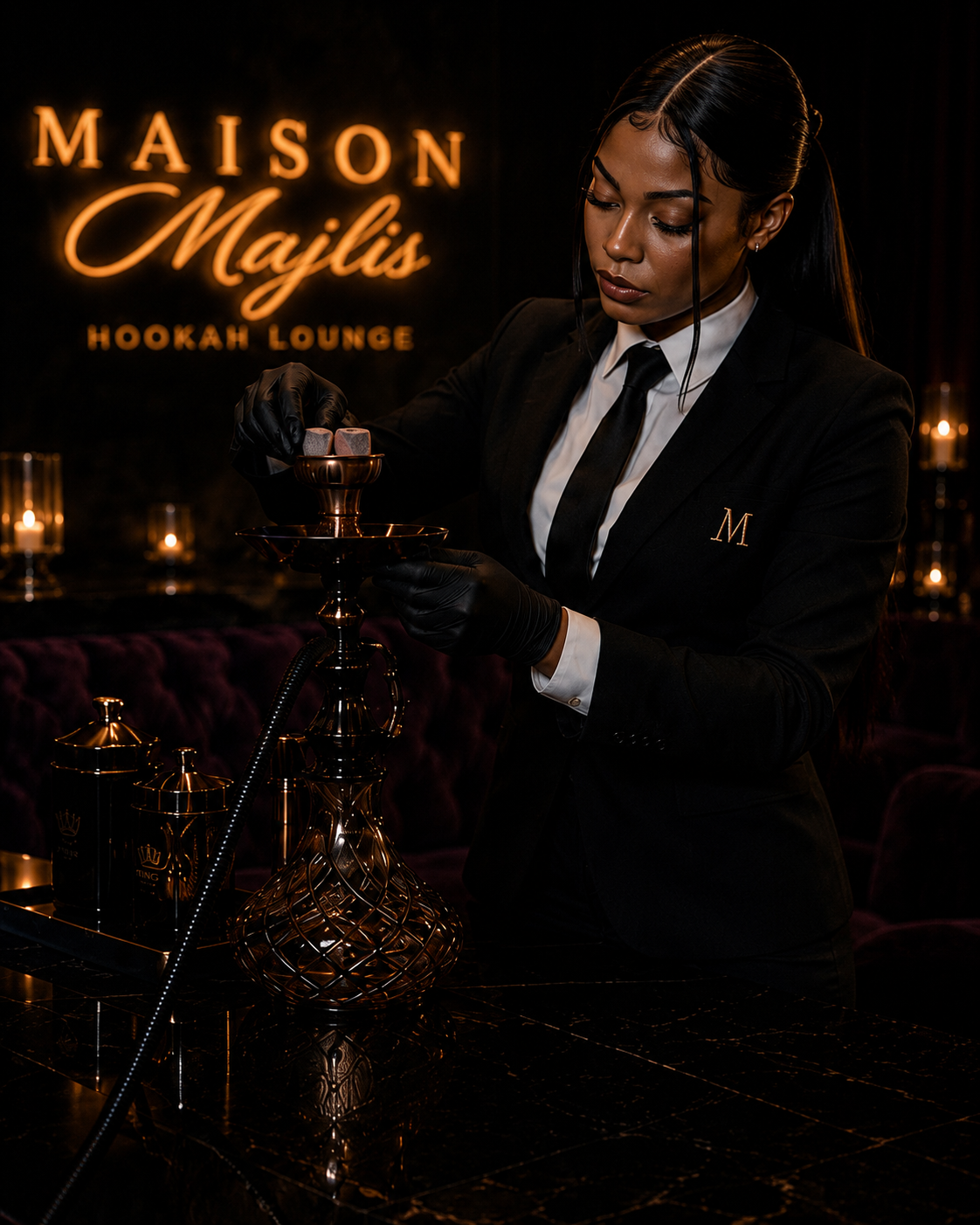 A woman in a black suit and black gloves prepares a hookah in a dimly lit lounge with a sign reading 'Maison Majlis Hookah Lounge' in the background.