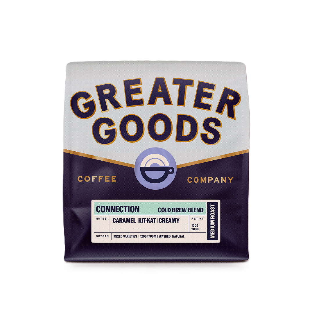 Bag of Greater Goods coffee with purple, white, and gold packaging labeled 'Connection Cold Brew Blend' with notes of caramel, Kit-Kat, and creamy, medium roast, 10 ounces.