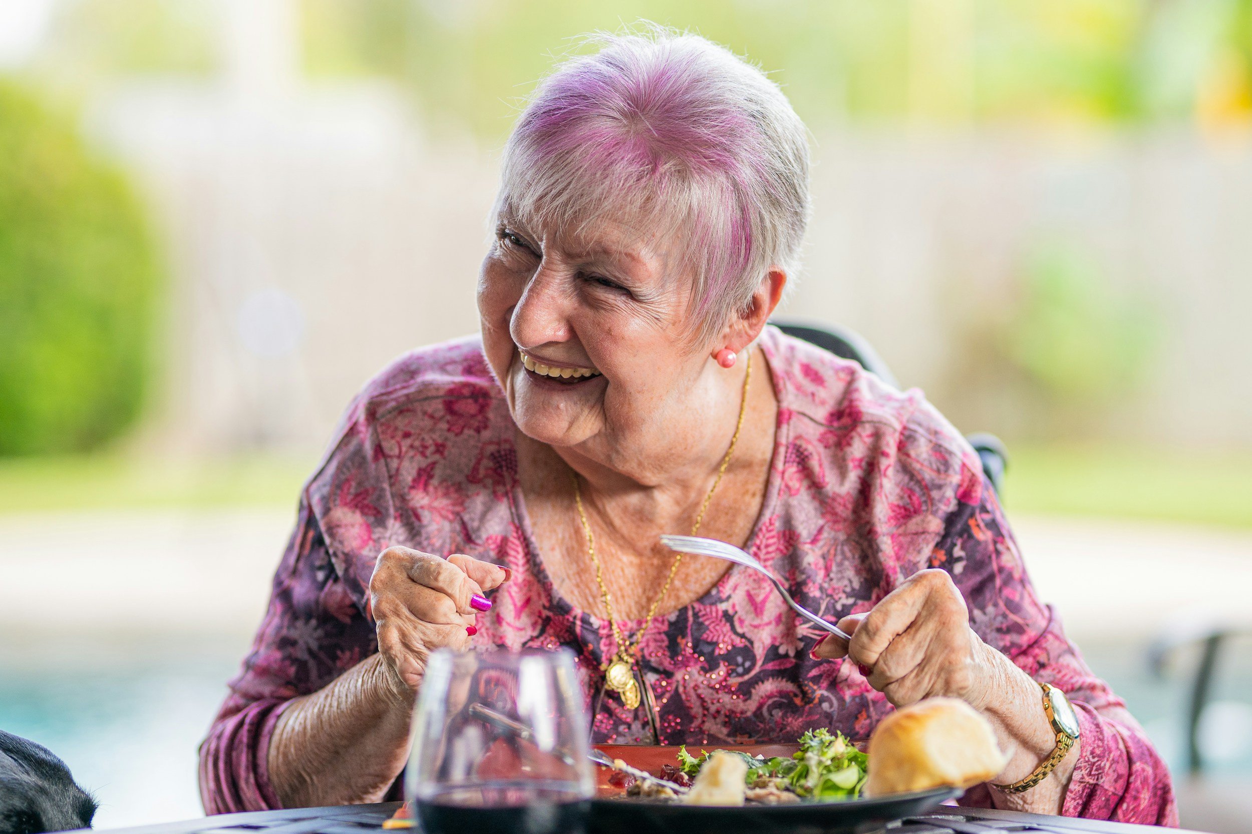 Smiling senior enjoying healthy aging and retirement planning supported by Community Benefit Advocates.