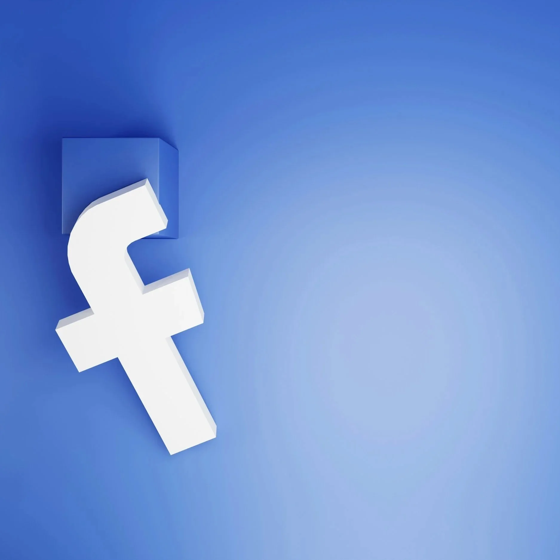 Close-up of a white Facebook logo against a blue background.