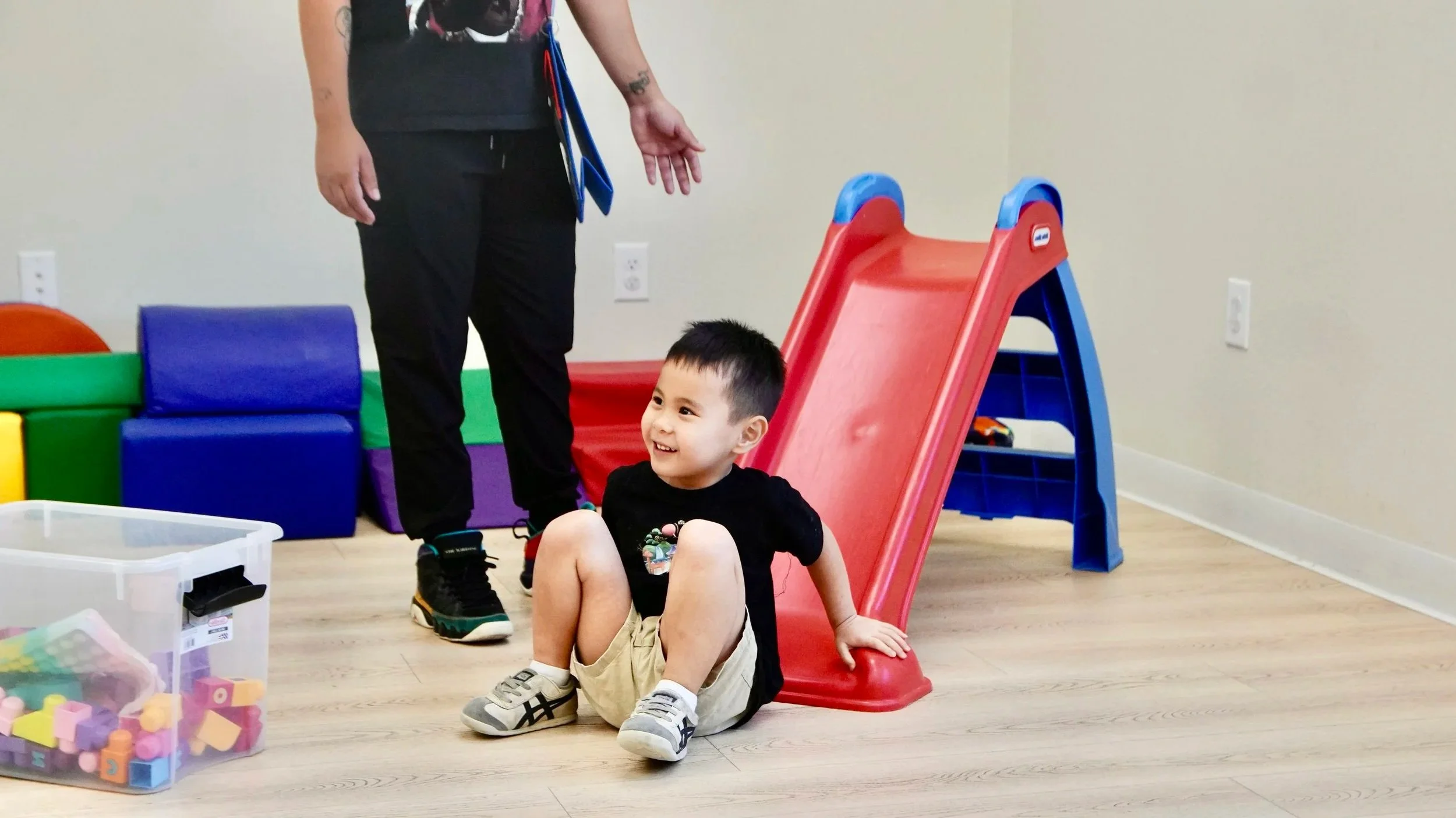 Autism Care Compass team member supporting children during a play-based activity.