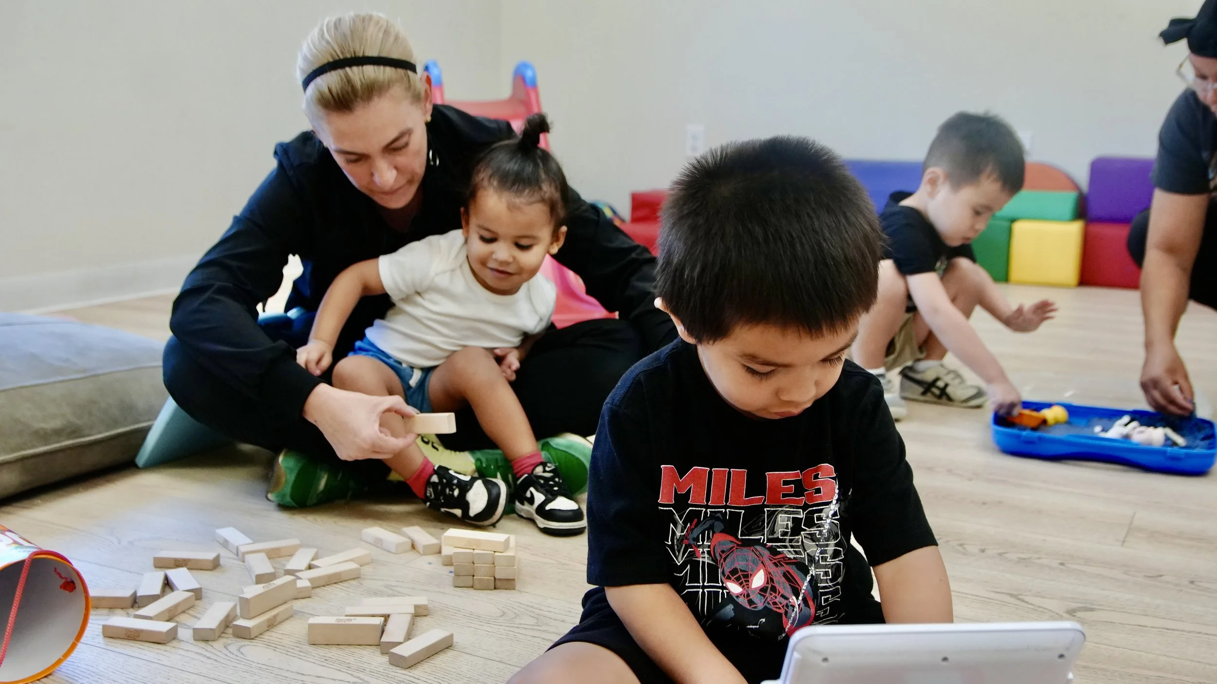 Child participating in a play-based activity at Autism Care Compass.