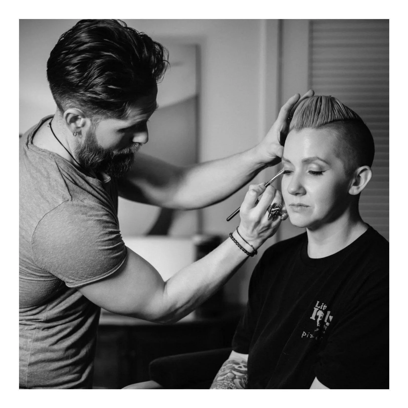 alt girl gets makeup done by male makeup artist