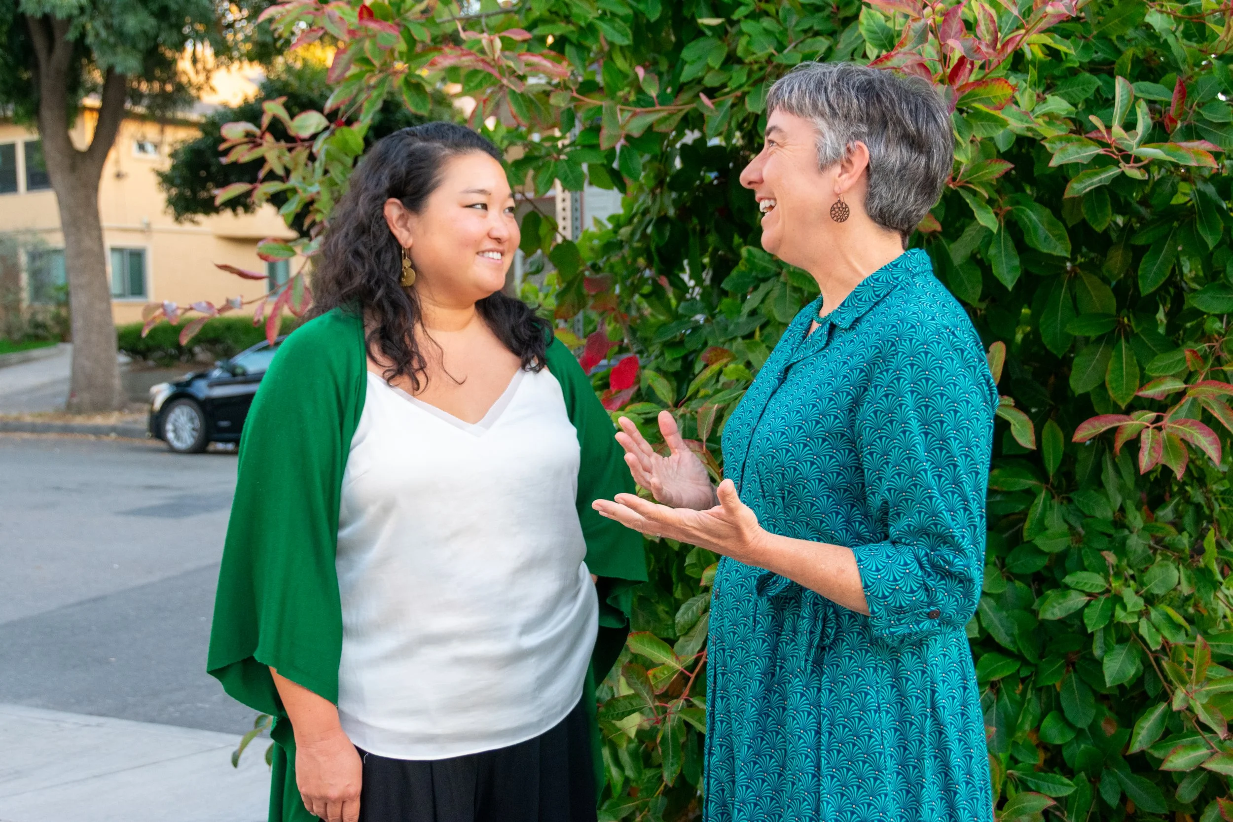 Daria Wrubel and a supporter in matching teal at a campaign event