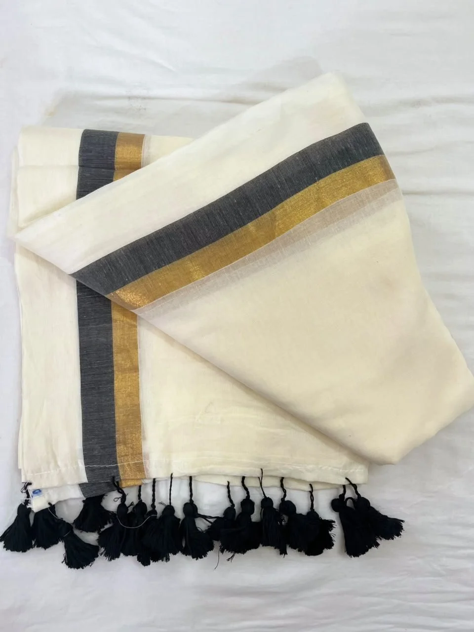 Elegance Handloom Mul cotton White Saree with Gold and Black Border