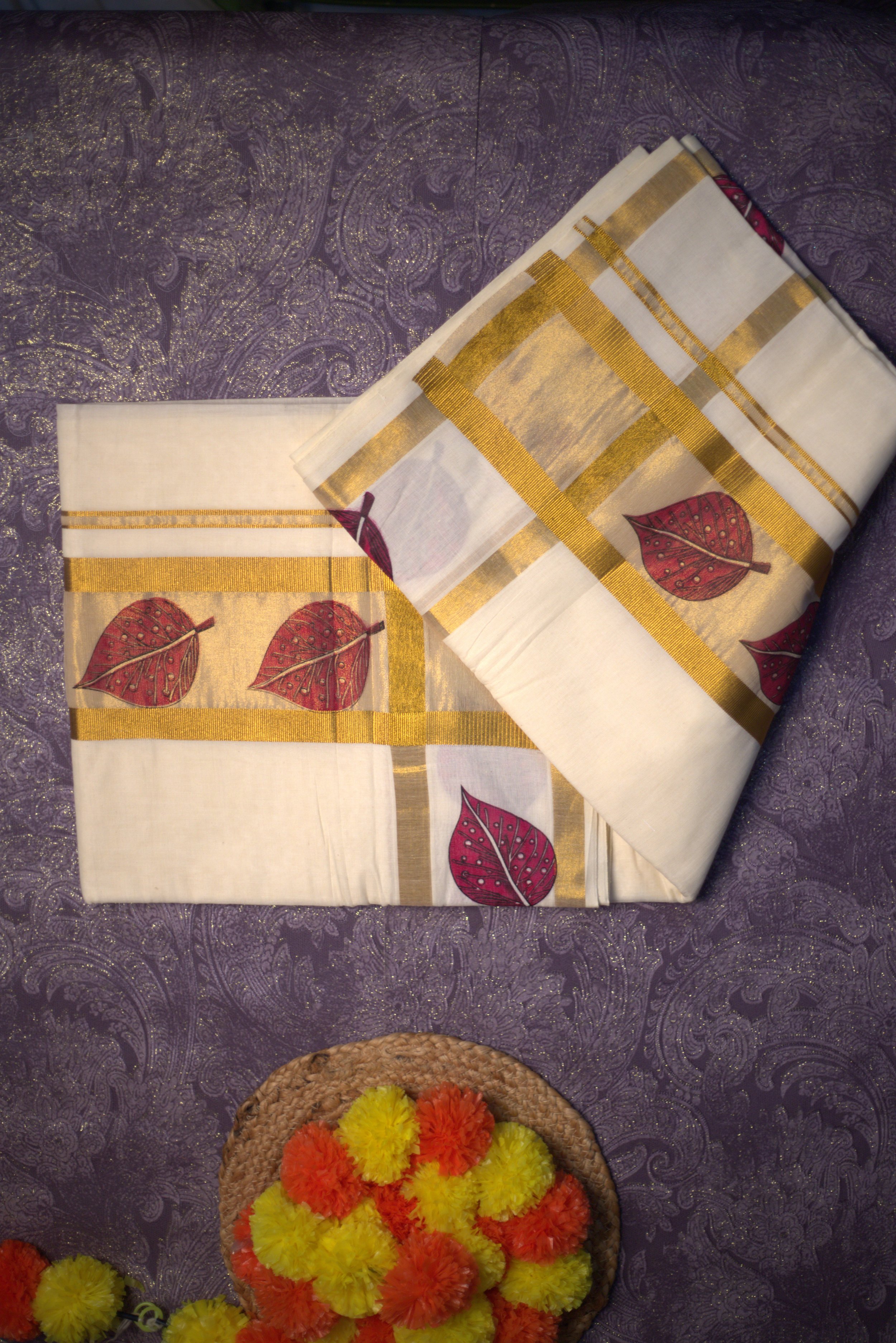 Elegant Kerala  Cotton Tissue Saree with Golden border and Red Leaf Motifs