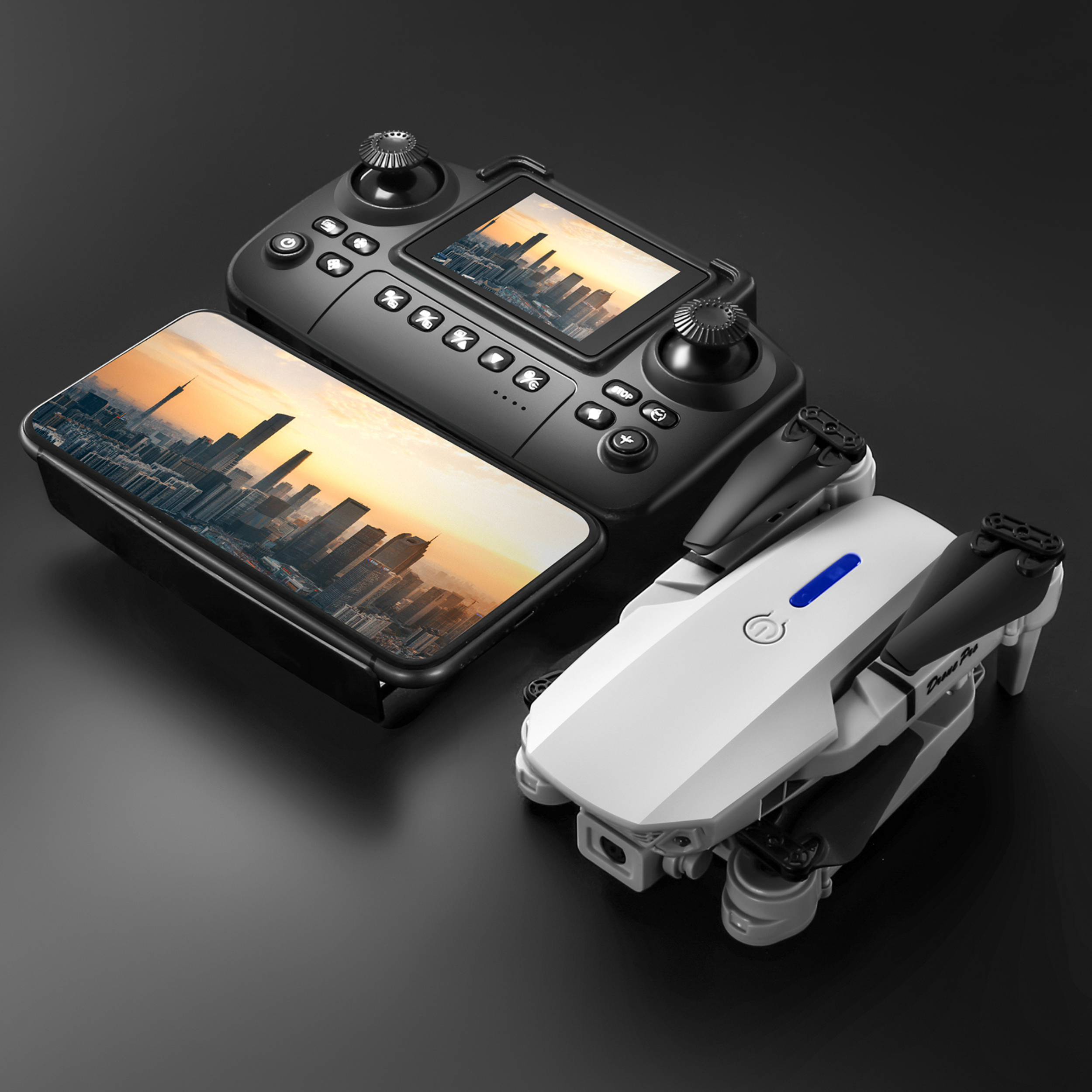 E88 Pro dual camera drone kit with remote controller, carrying case, spare propellers, charging cable, batteries, and accessories