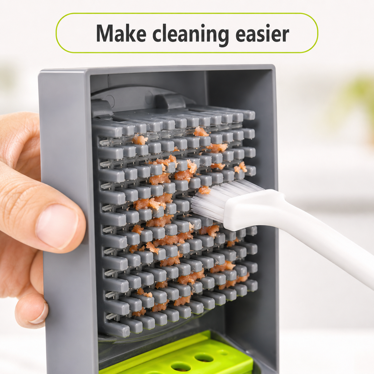 Cleaning brush removing food pieces from mandoline slicer blade grid for easier cleanup