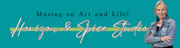 Suz Carroll in a denim jacket with crossed arms, smiling in front of a teal background displaying the text "Musing on Art and Life! Horizon & Spice Studio" in stylish fonts.