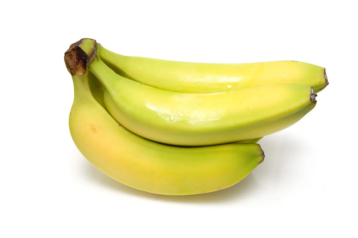 A bunch of ripe bananas on a white background.