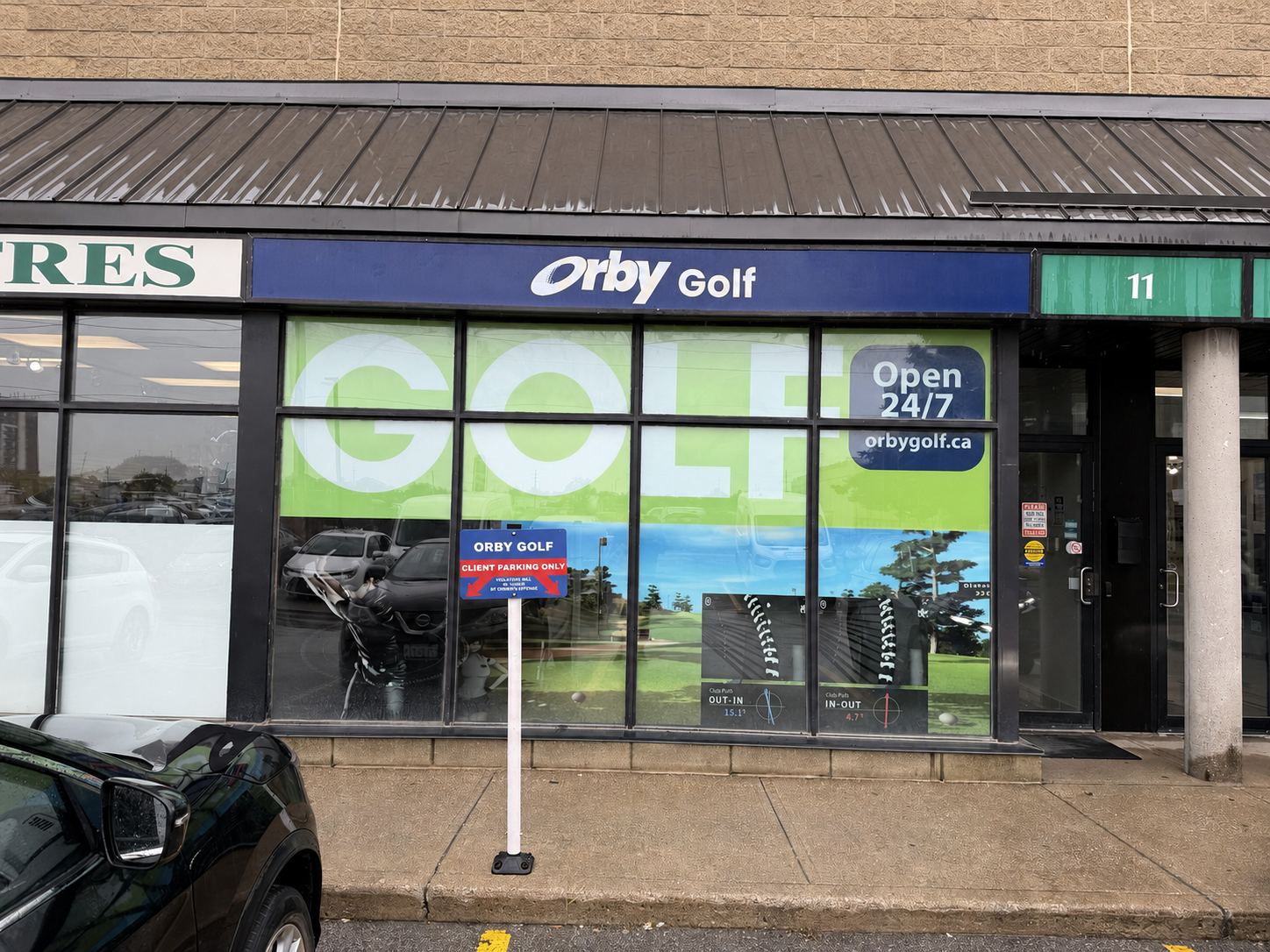 Orby Golf Milton storefront at Nipissing Square, with the Orby Golf parking sign.