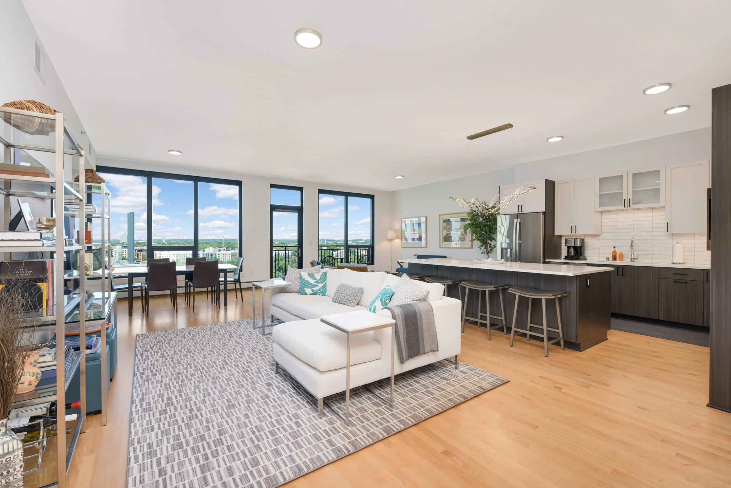 Open-concept living space. Condo living space with large kitchen. Condo with Mississippi river views and Stone Arch Bridge views.