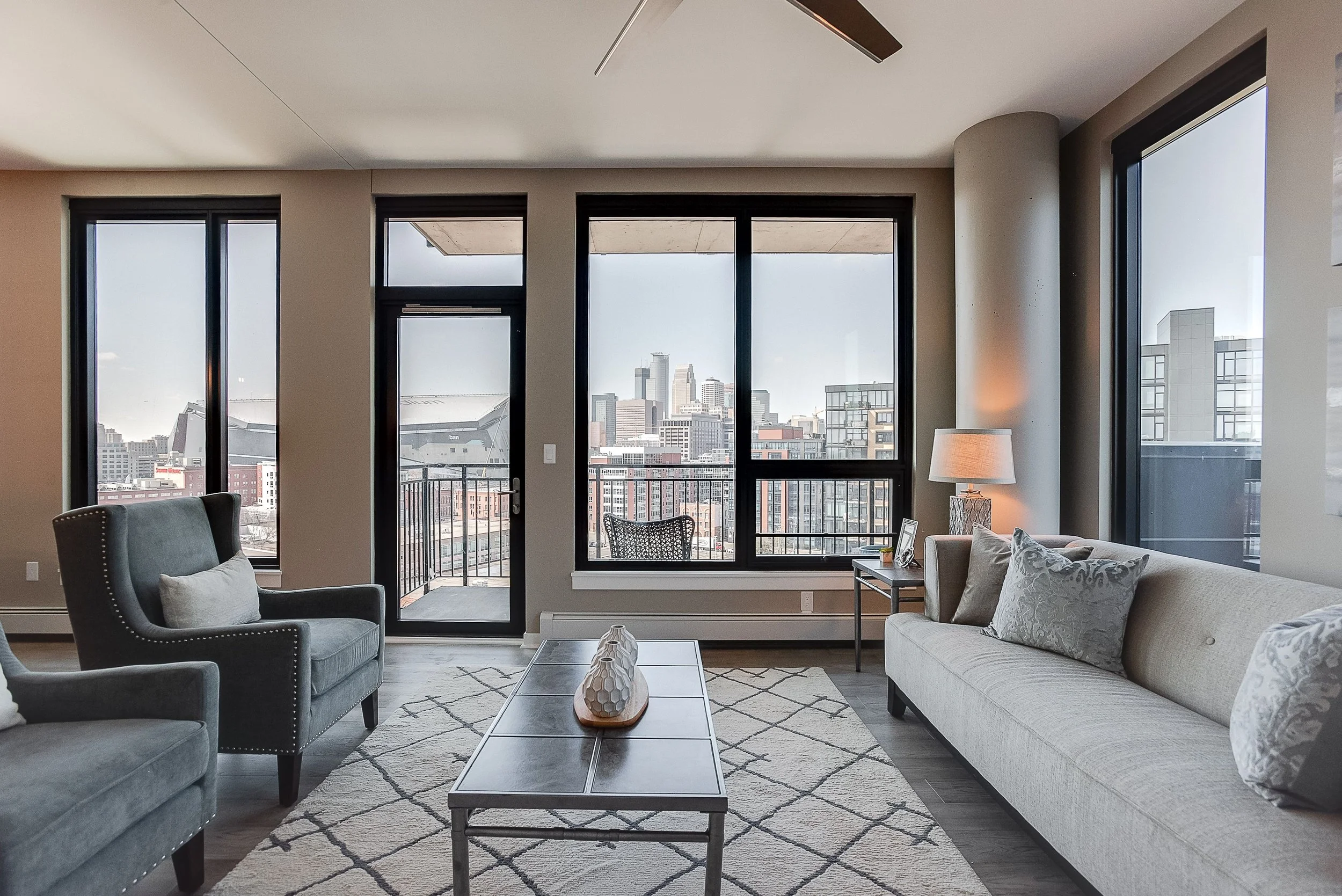 Luxury Minneapolis condo living room with skyline views. Corner unit.