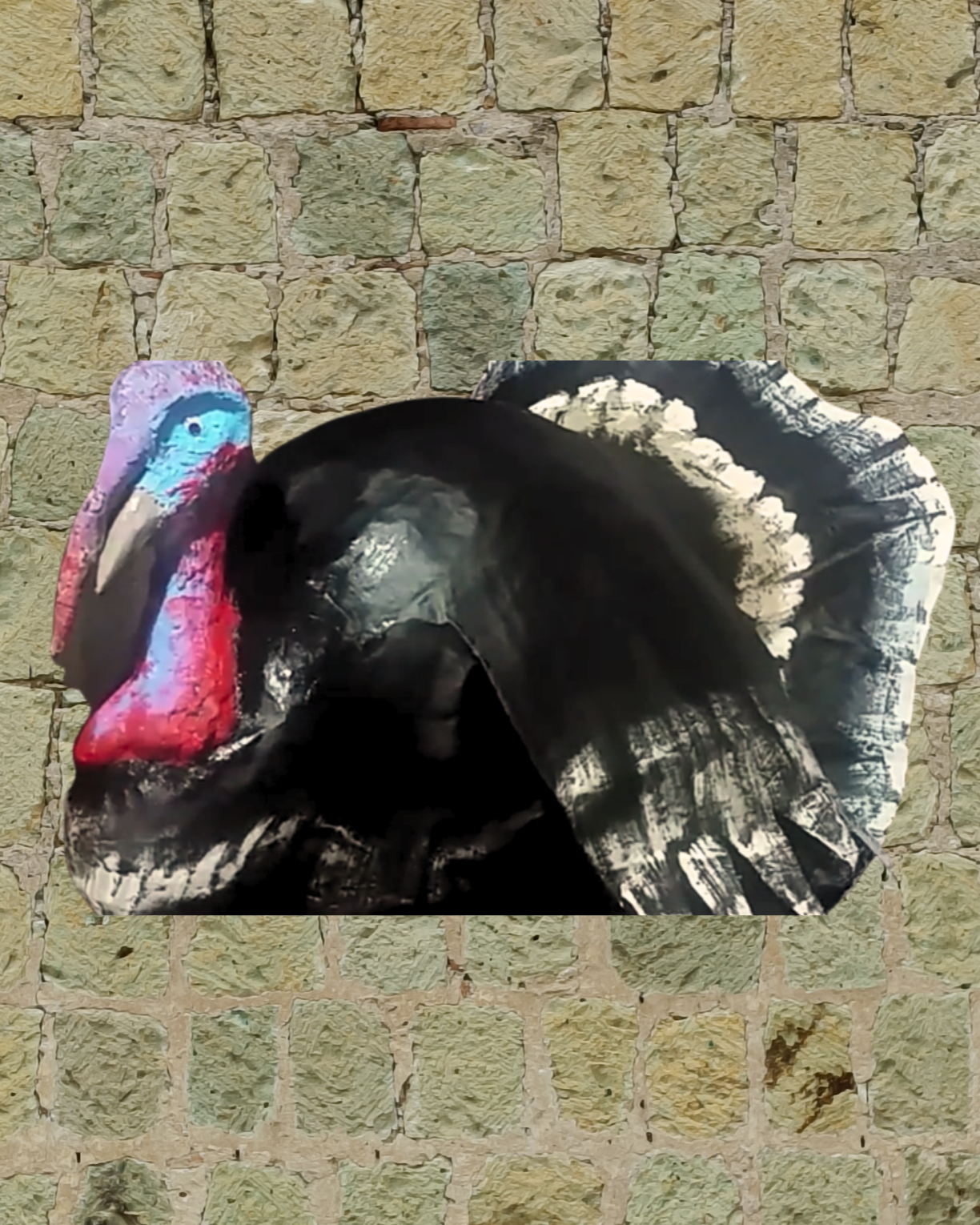 Artistic rendering of a turkey's head and tail feathers against a stone brick wall background.
