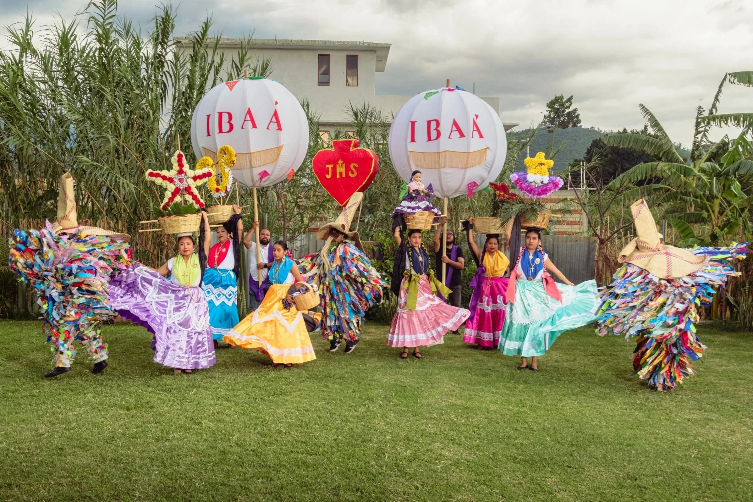 Guelaguetza package: full traditional Oaxacan calenda troupe with dual branded balloons and dancers