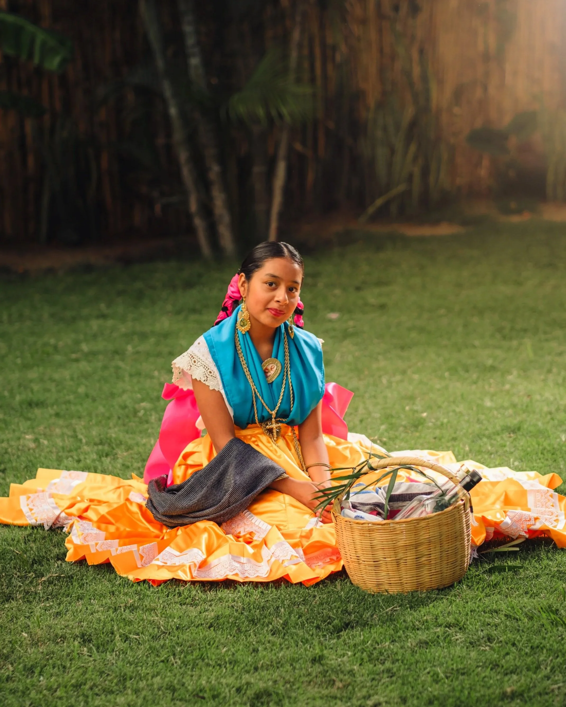 Young girl in traditional Oaxacan dress with woven basket, calenda wedding parade attire