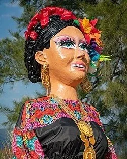 Giant Oaxacan puppet (mona) in traditional dress, calenda parade icon