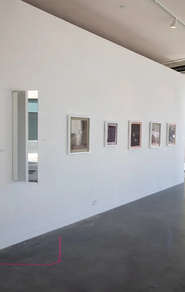 Cabinet Mirror and Massachusetts Avenue Facing Wall in Gallery Installation - Four of the five frames contain Digital Archival Inkjet Prints on Hiromi Paper and the smaller frame is a Salt Print that is fading overtime. 