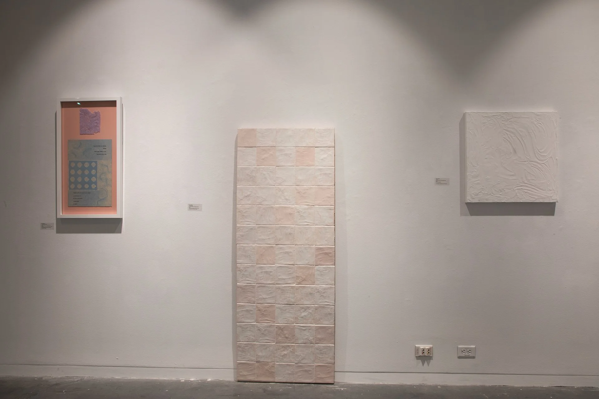 Installation Shot of Letterpress and Handmade Hair Paper Piece, Laser Engraved Tile Wall Piece and Sensory Piece 