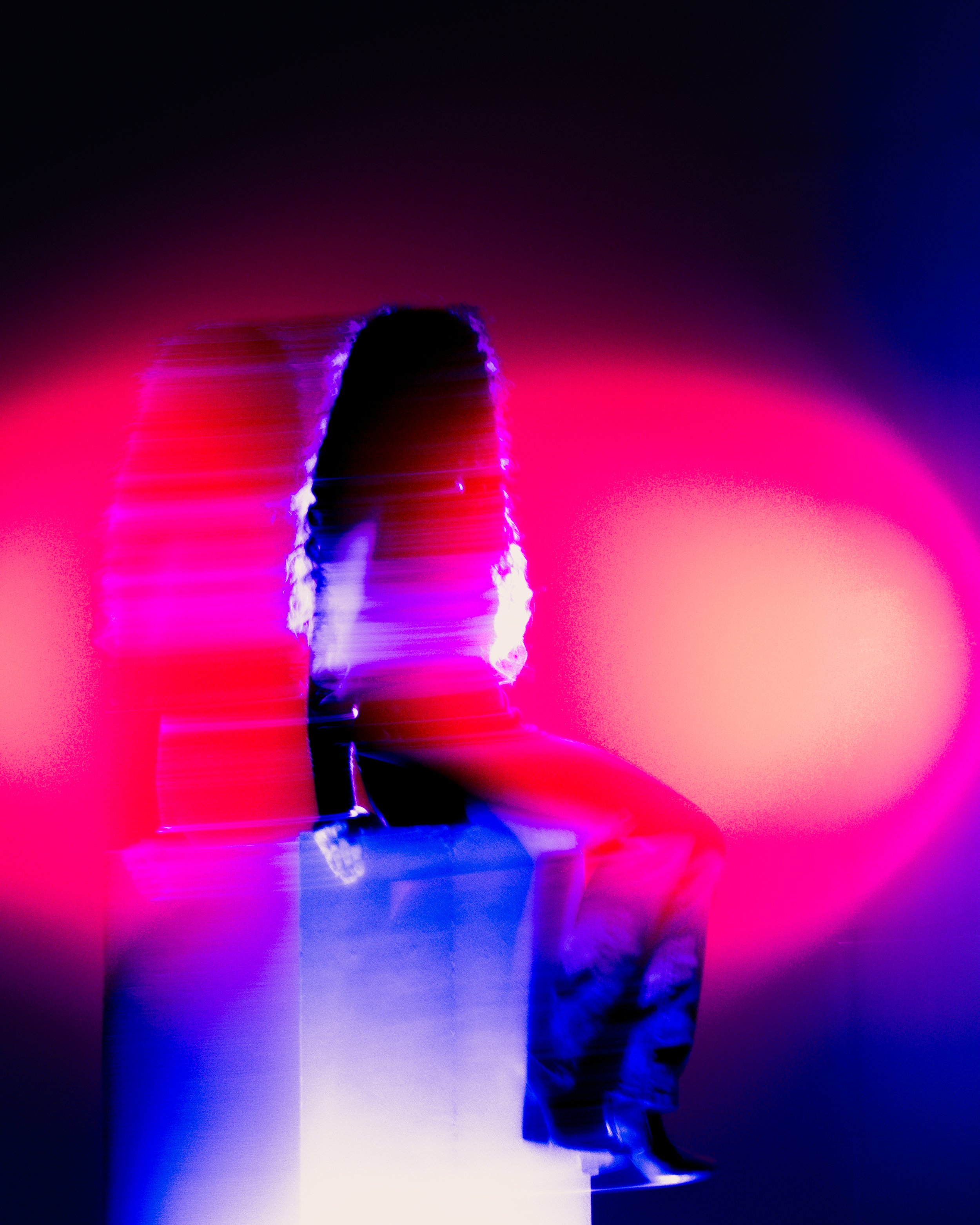 A person holding a wine glass filled with red wine, with a vibrant pink and purple neon background and glitch effects.