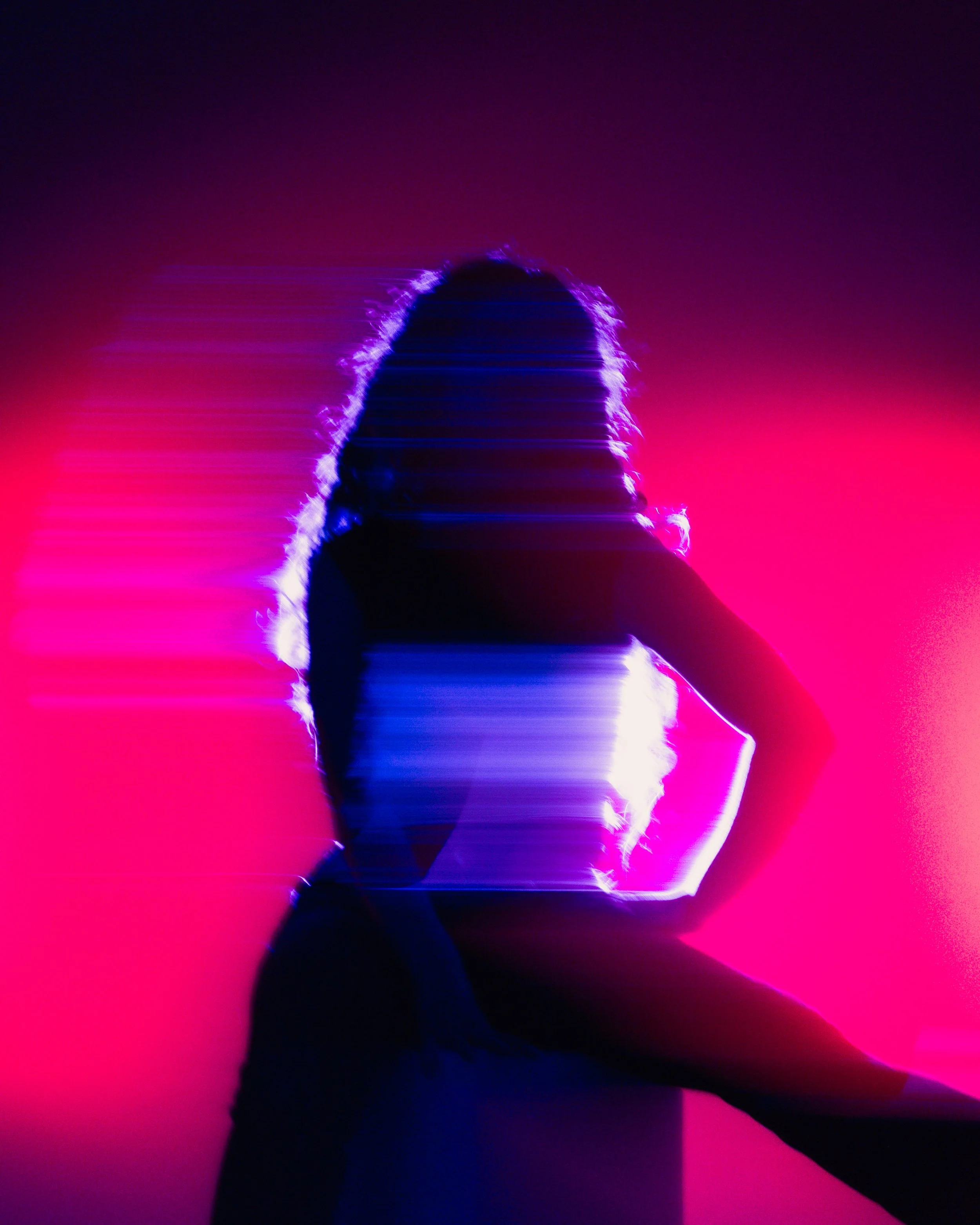 Person standing with an arm raised, silhouette outlined with neon purple light, against a pink and purple gradient background, with a futuristic, digital aesthetic.