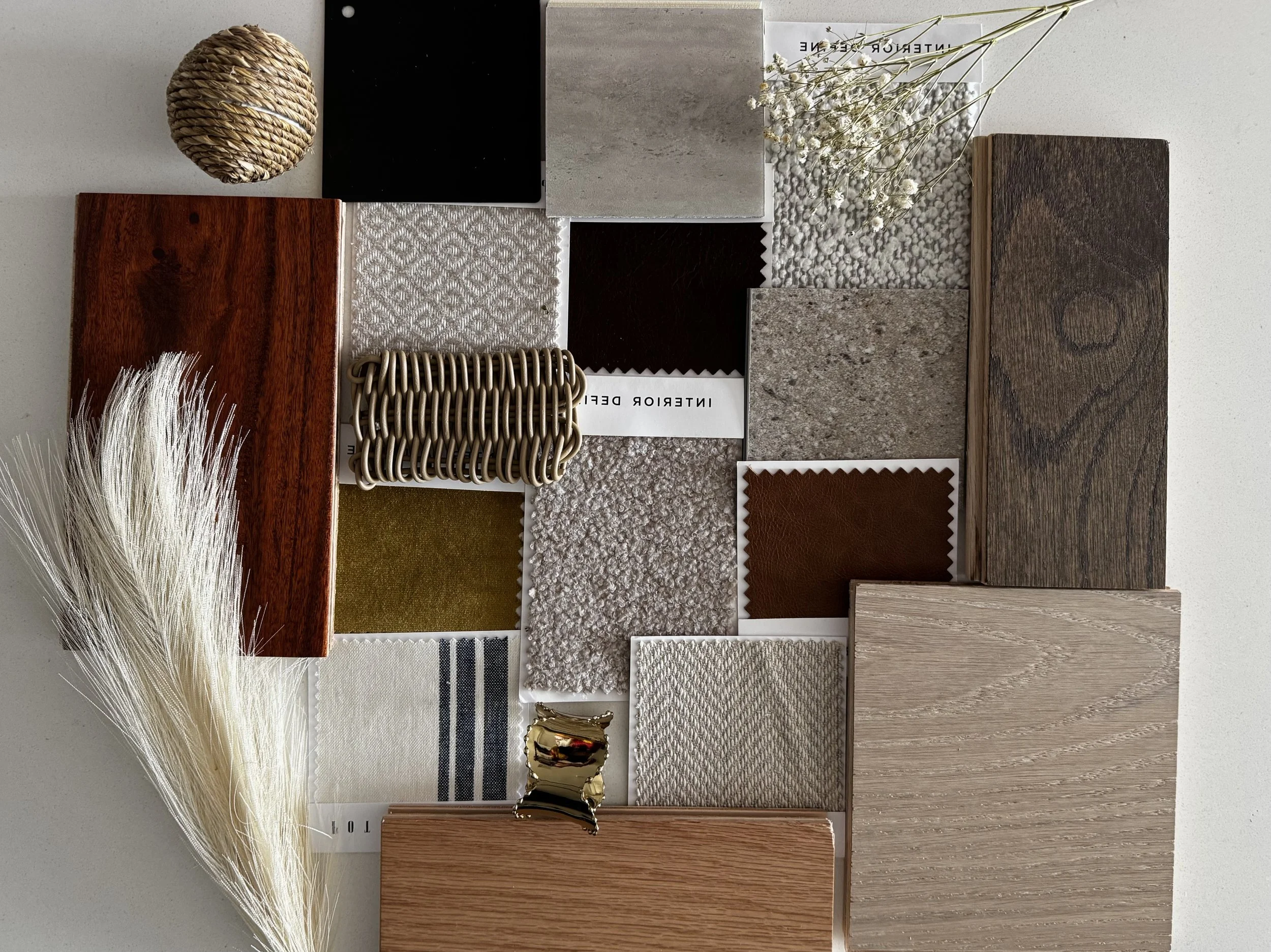 Interior design materials board featuring wood, textile, stone, metal, and decorative accents for a neutral bedroom design.