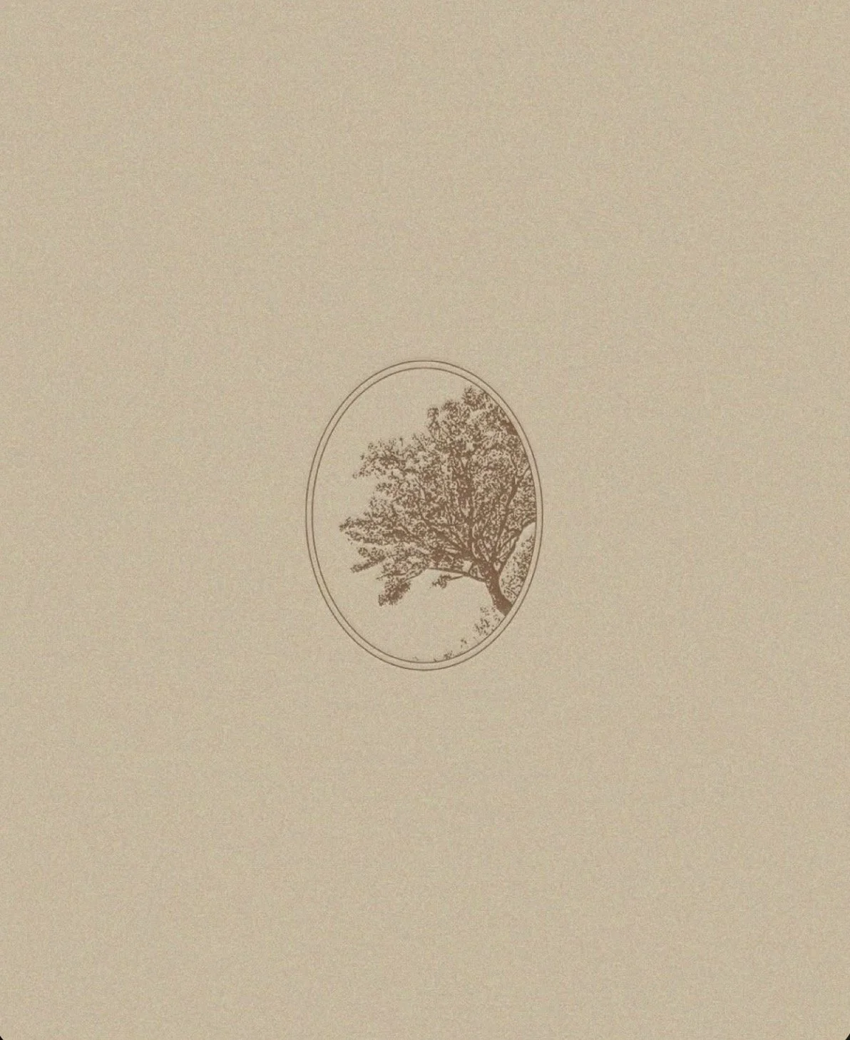 A beige surface with a small, oval-shaped illustration of a tree in the center.