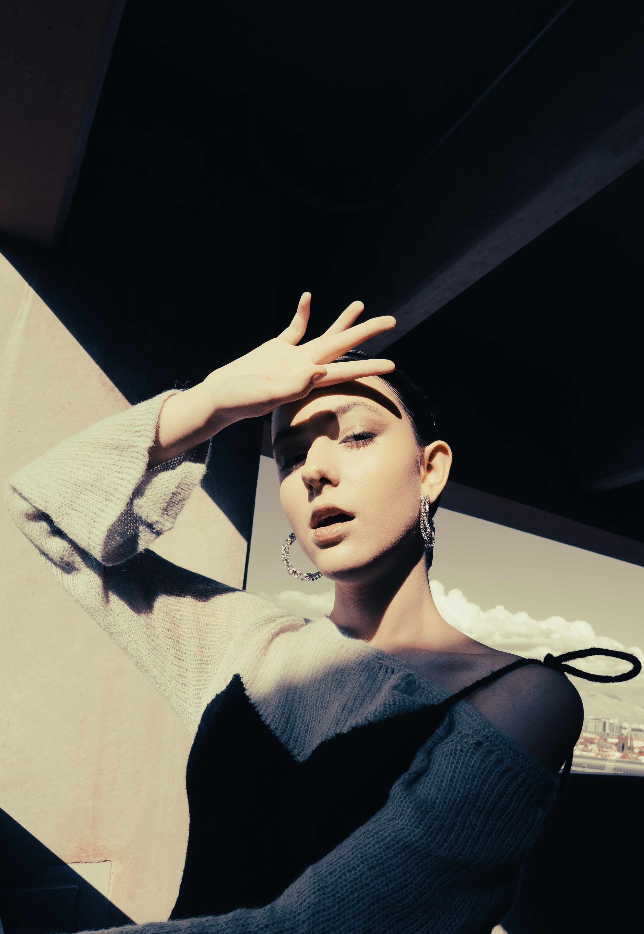 Lia Saceanu, Models Melange talent, in a dynamic editorial pose, photographed by Briana Rambo, downtown Tucson, Arizona.
