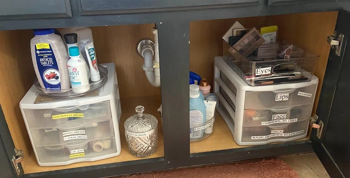 under the sink bathroom toiletry organization idea containing two lazy susan turn tables and two 3-drawer units with labels