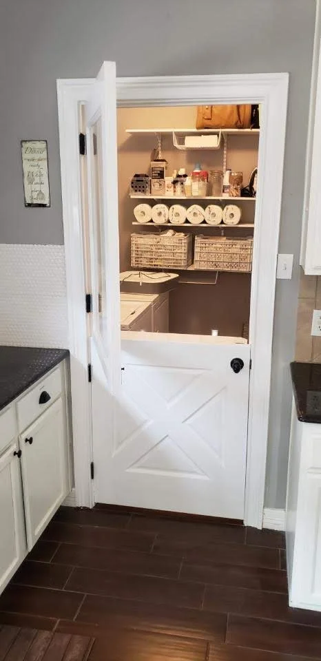 white pantry Dutch door storage inside laundry room in Magnolia, TX
