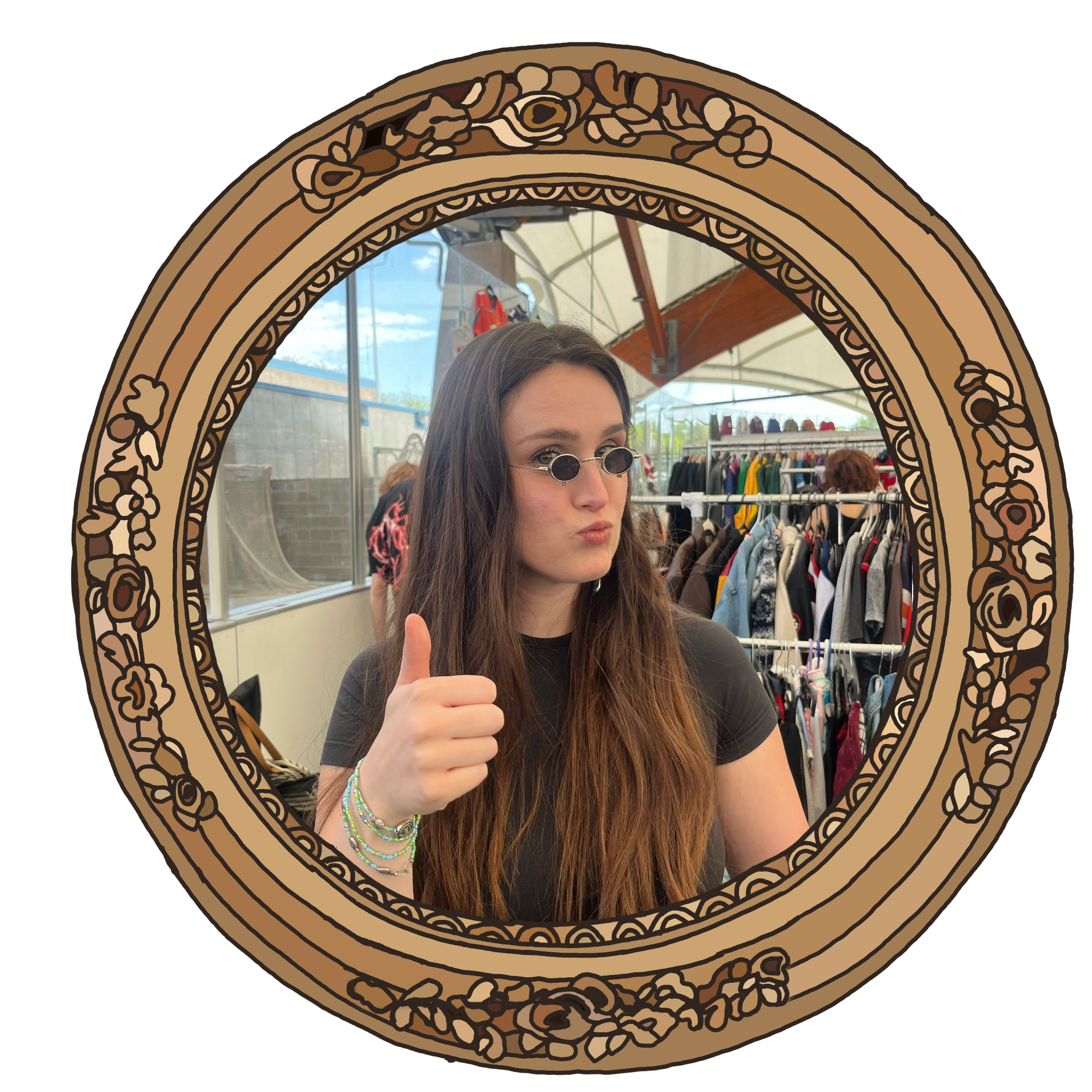 Playful portrait of Madeline Conley giving a thumbs-up, seen through an ornate, vintage-style mirror with a wooden frame, in a store with clothing and accessories in the background.