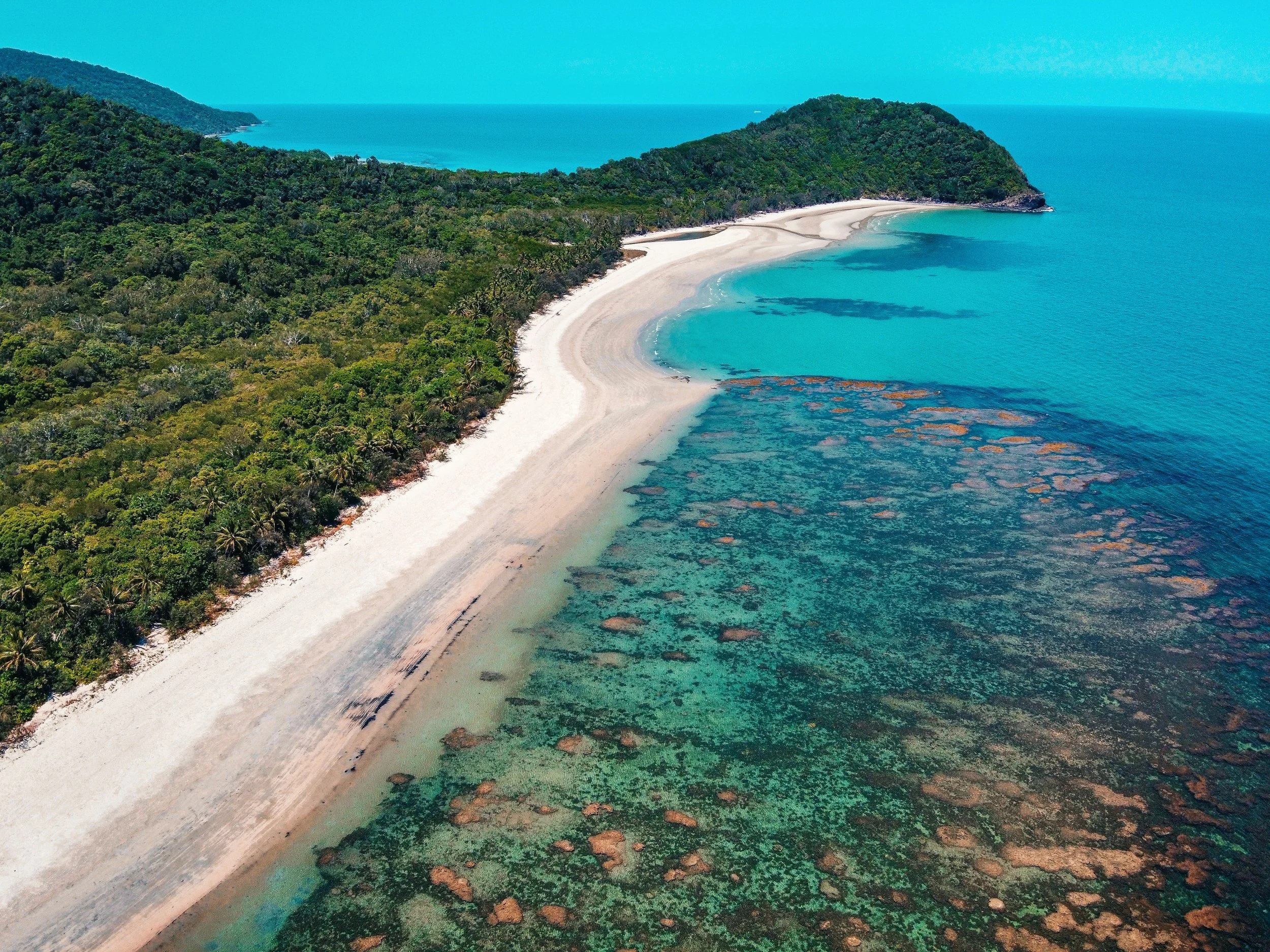 Aerial view of Tropical North Queensland near Cairns, Australia, highlighting the natural beauty and adventure experiences that complement destination marathon travel.