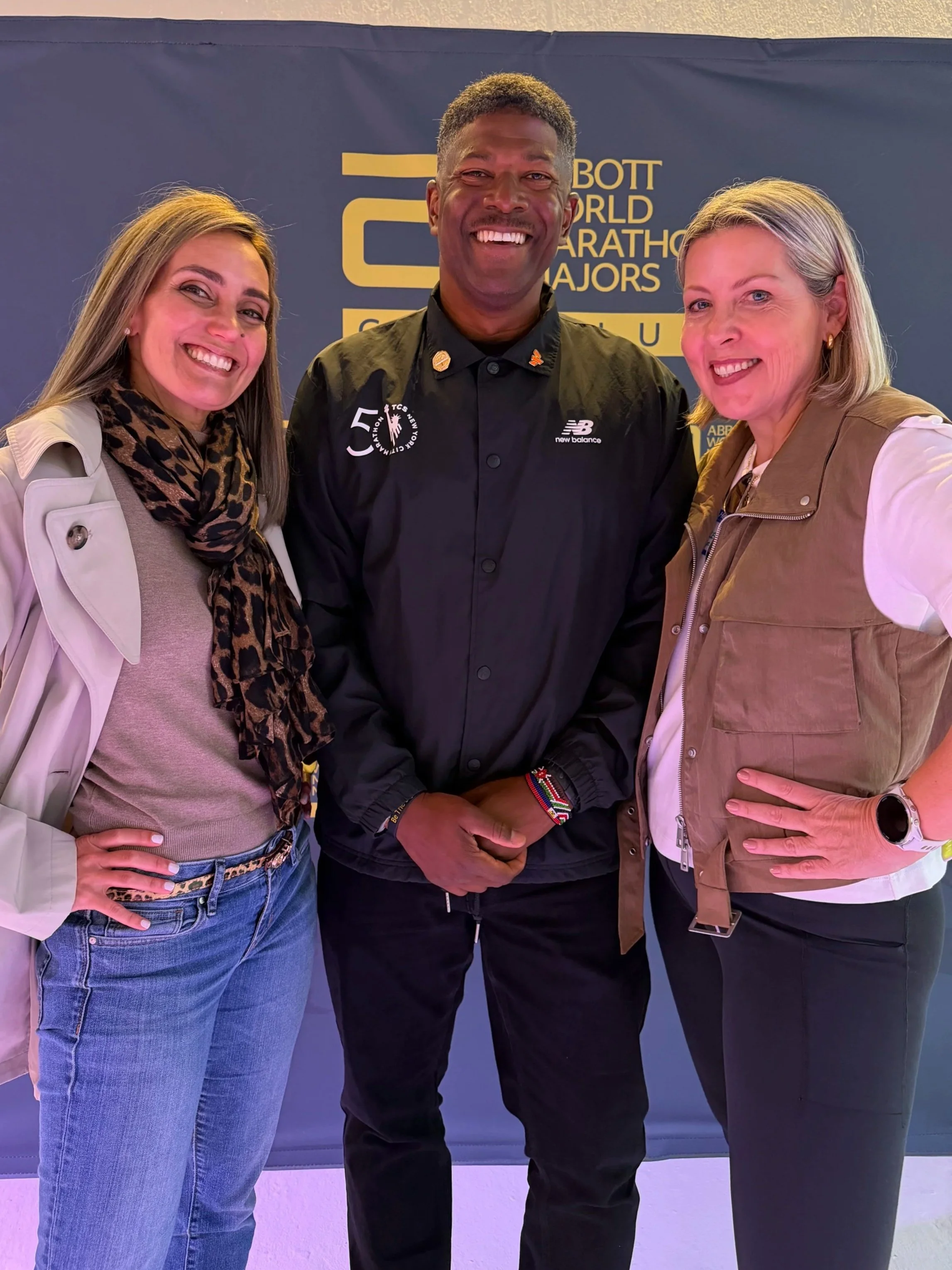 Heidy Arellano and Karen Kroboth with Ted Metellus, NYRR Race Director, at a major marathon industry event, representing LATAM Marathon Experience and the international running community.