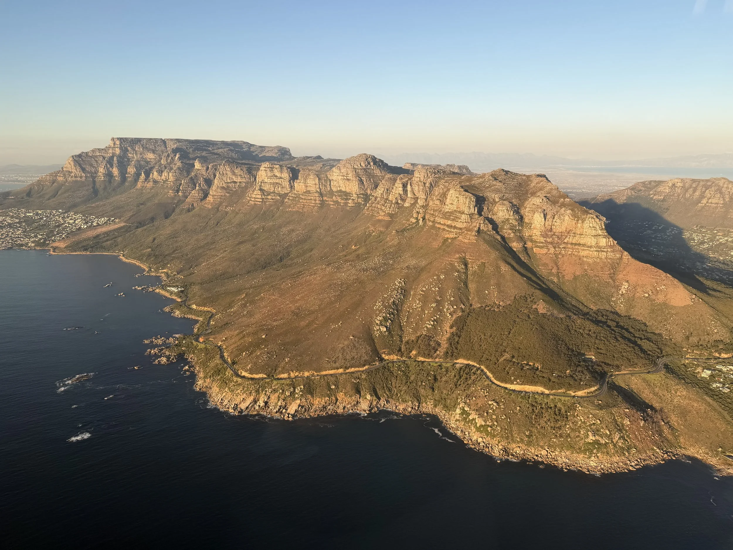 Aerial view of the Twelve Apostles mountain range and Cape Town coastline in South Africa, a destination experience featured in LATAM Marathon Experience marathon travel packages.