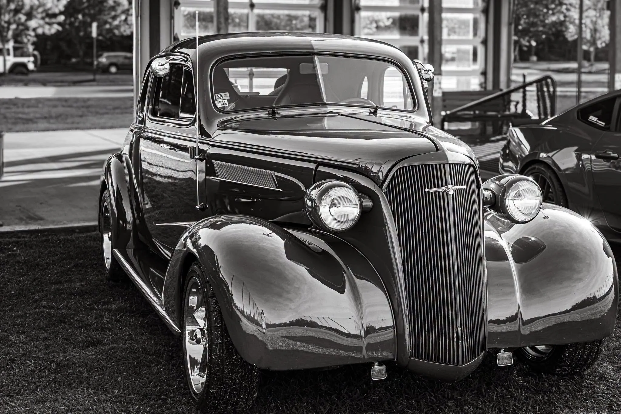 Parked right here, this beauty feels less like a car and more like a time machine. The sweeping curves and brilliant chrome details are a tribute to an era when cars had true soul and craftsmanship.