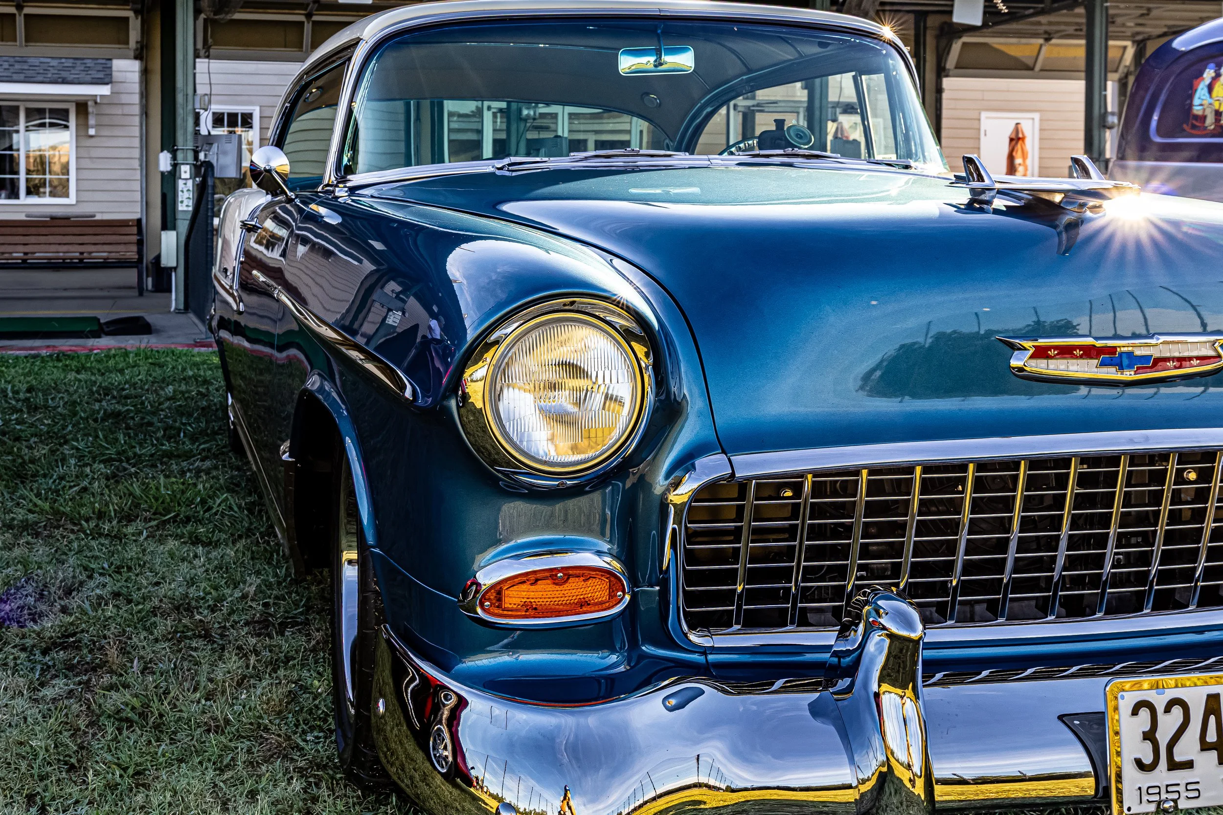You just can't walk past a classic like this without stopping. This stunning vintage blue Chevy was catching everyone's eye. The paint job is so flawlessly glassy you can see the house and the sky mirrored right on the hood. It’s pure American muscle