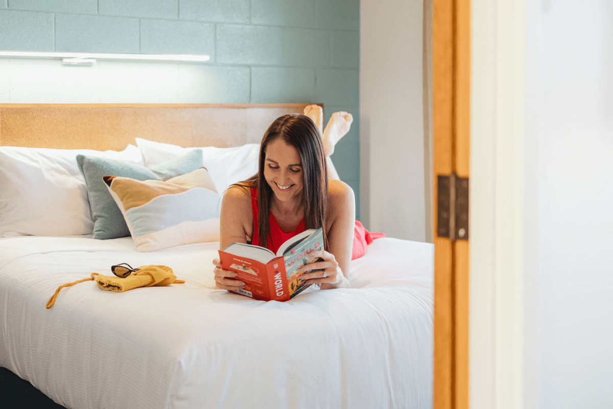 1br-suite-bedroom-reading.png