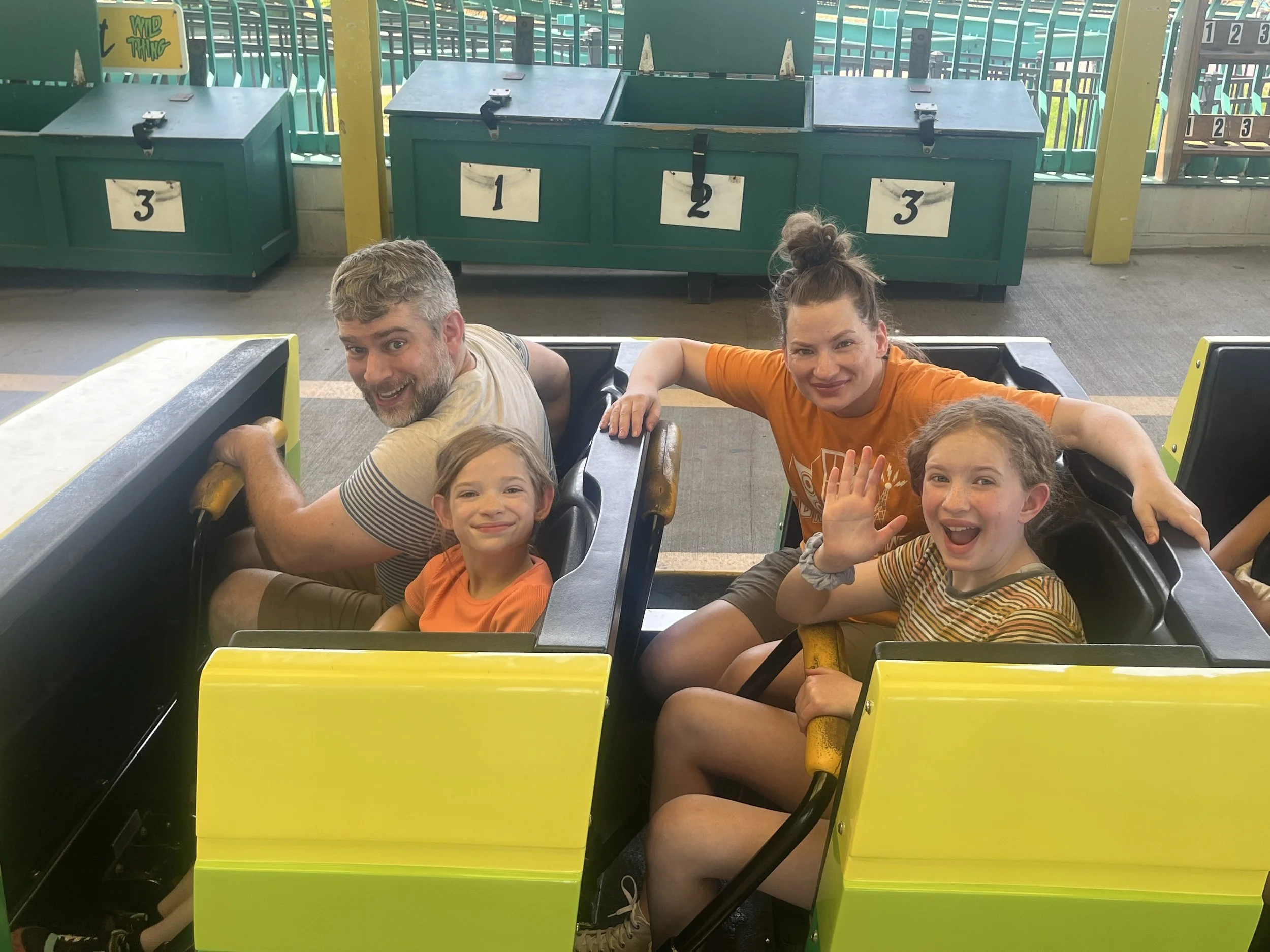 Benton and his family smiling on a car of the Wild Thing rollercoaster at Valleyfair