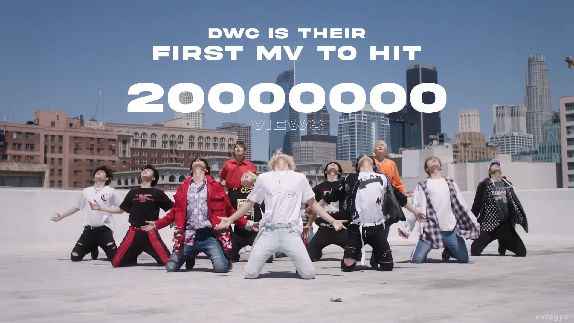 A group of young people dancing on a rooftop with a city skyline in the background, and text overlay indicating music video hit milestone.