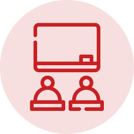 A red circle icon of students in the classroom.