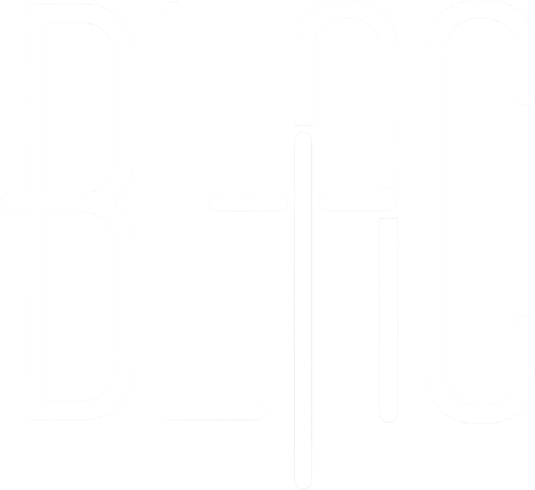 Neon sign with the word "BEER" in bold, white letters on a black background.
