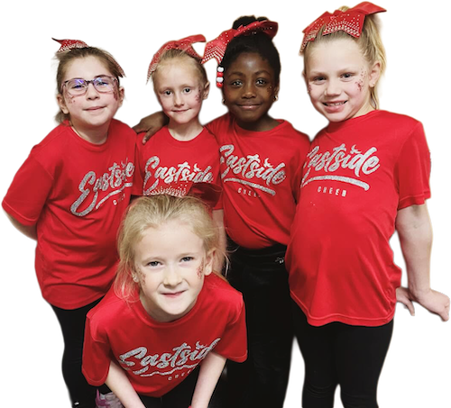 Five young girls wearing red cheerleading uniforms with large red bows in their hair, posing together for a group photo.