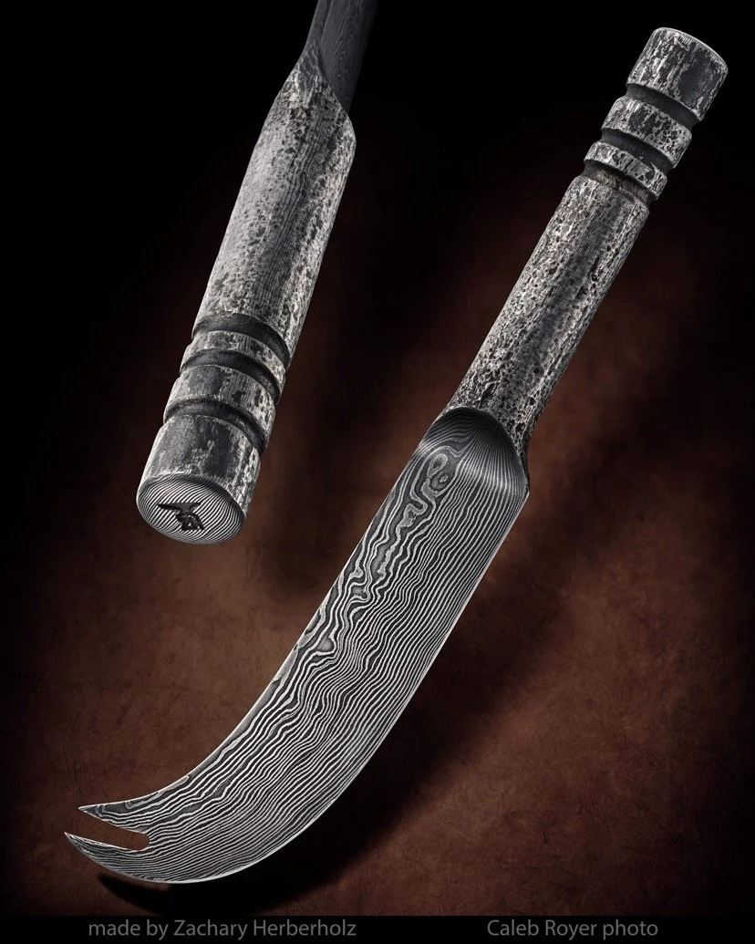 Close-up of a forged damascus cheese knife  with a textured, patterned blade and handle, placed against a dark background.