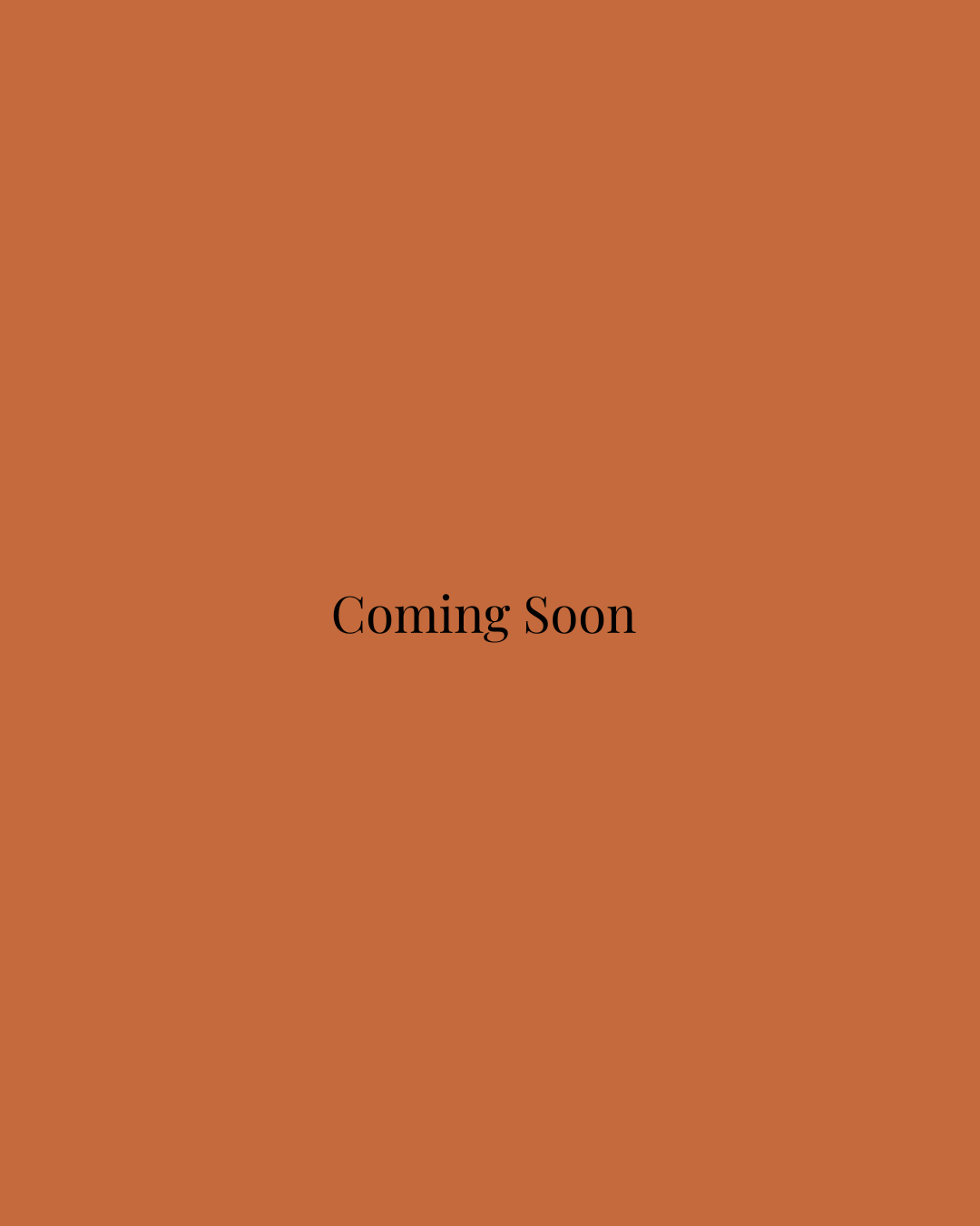 A brown background with black text that says 'Coming Soon'.
