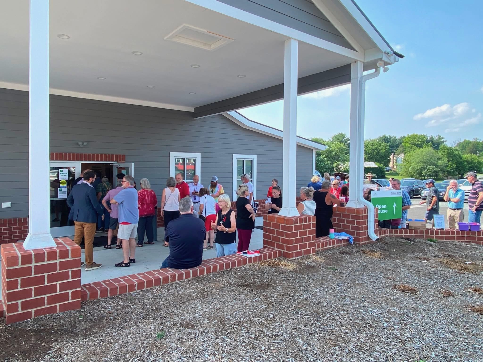 Locals gathering outside of the "Open House" at the Lovettsville Game Club