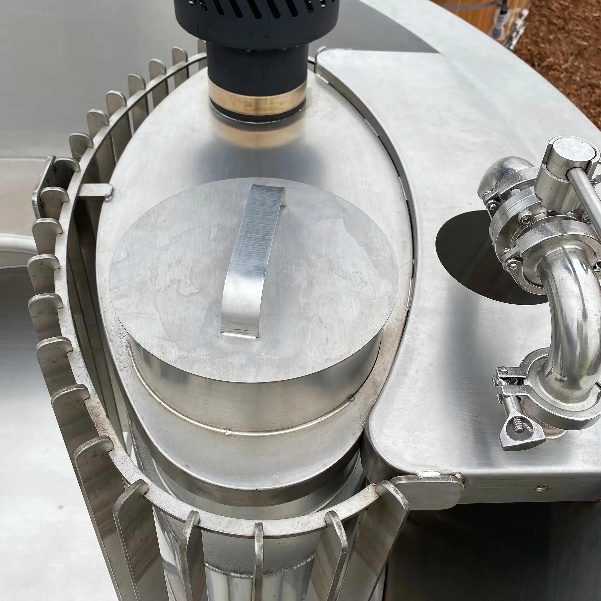Close-up of the wood fired hot tub heater chamber in stainless steel.